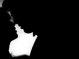kissing couple in dark sneaky